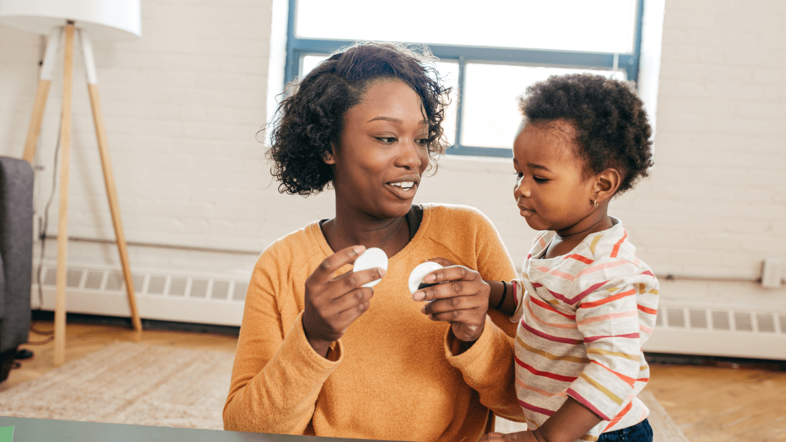 A young child looking directly into the camera with soft lighting, symbolizing trust and emotional connection in caregiving.